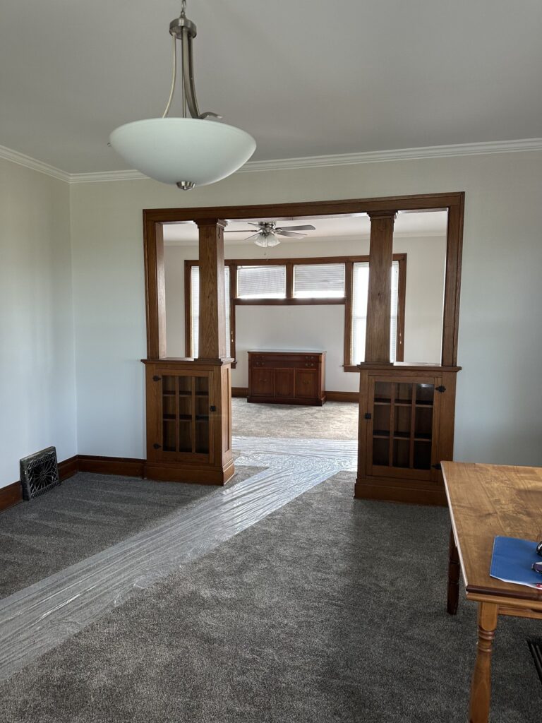 Living room with french doors and original woodwork