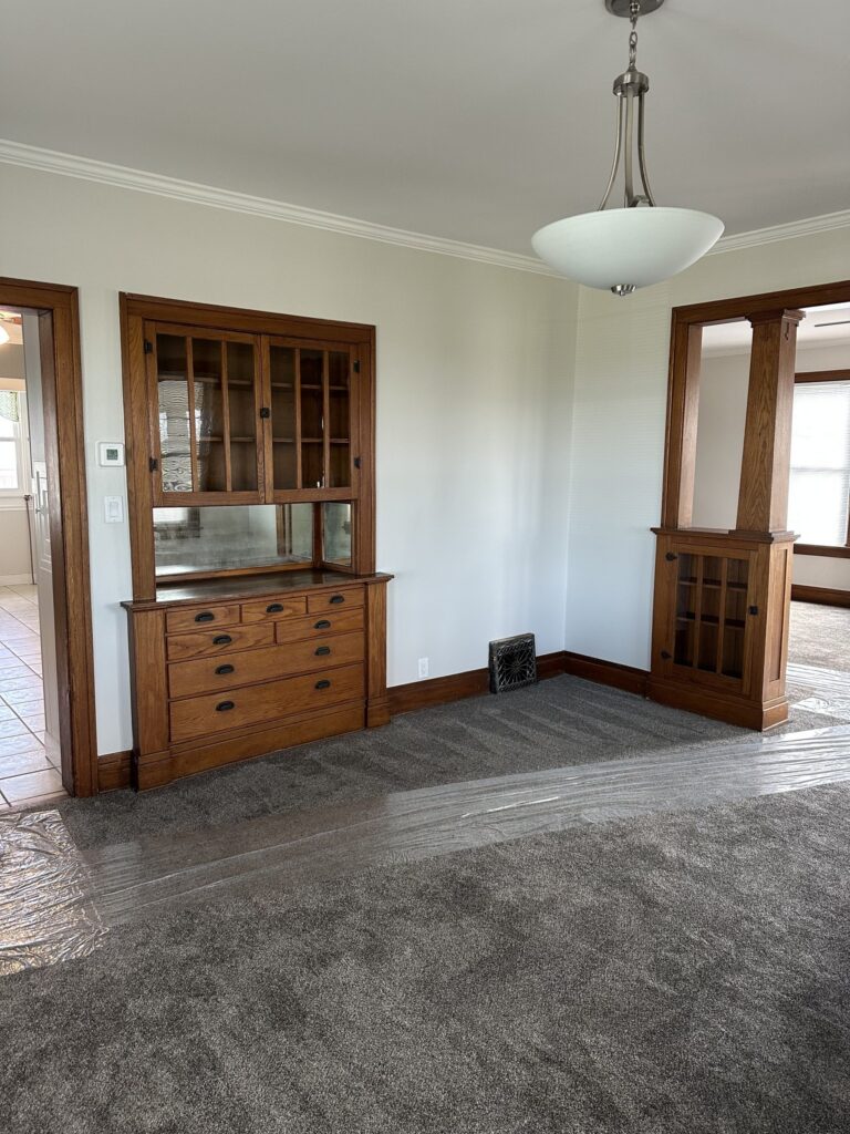 Dining room with built-in hutch and leaded glass cabinets
