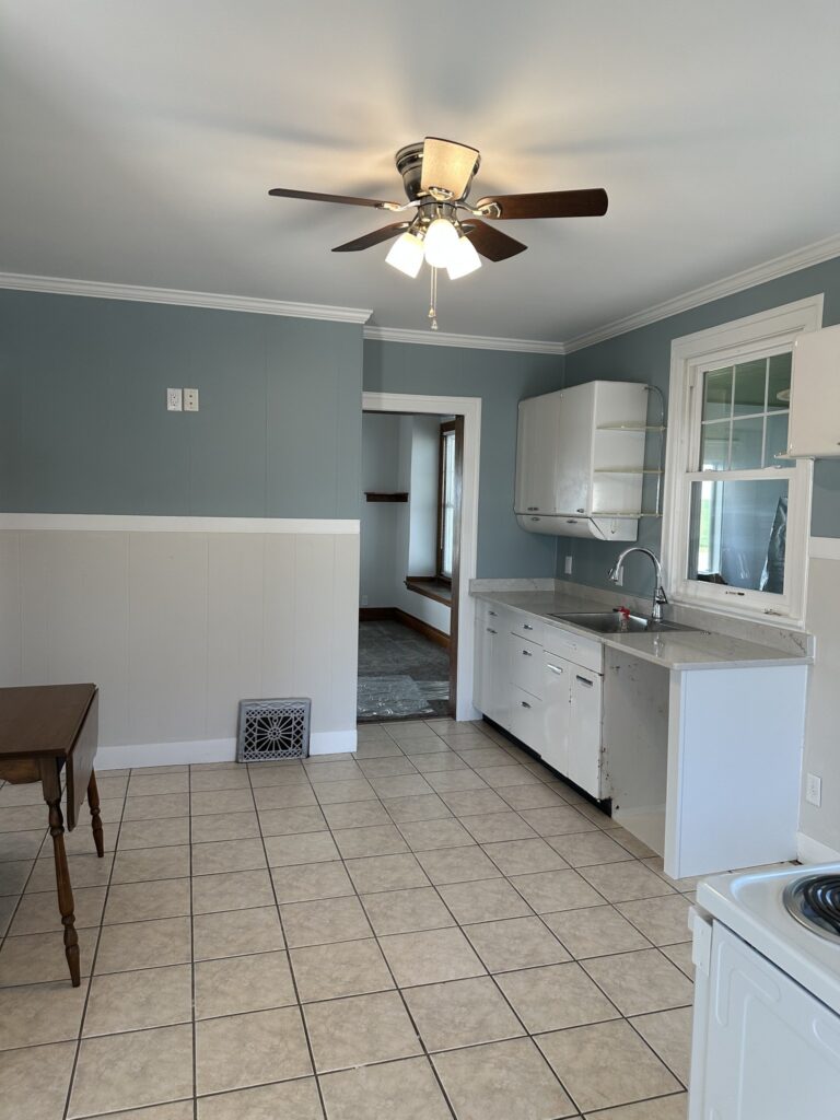 Kitchen and eat-in dining area with tile floor